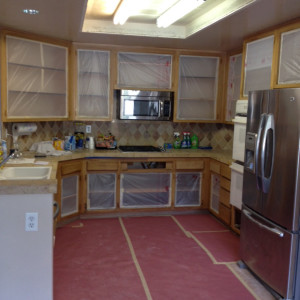 Taping the kitchen cabinets